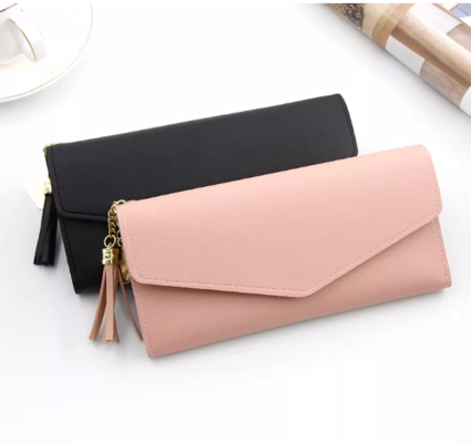 ladies long wallet with gold heart tassel zipper and snap button closure.