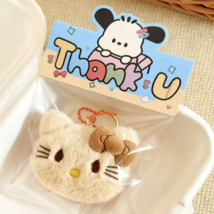 A collection of colorful, assorted mini plush keychain charms arranged neatly, individually packaged.