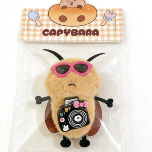 A collection of colorful, assorted mini plush keychain charms arranged neatly, individually packaged.
