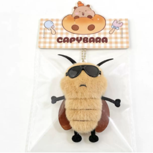 A collection of colorful, assorted mini plush keychain charms arranged neatly, individually packaged.