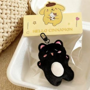 A collection of colorful, assorted mini plush keychain charms arranged neatly, individually packaged.