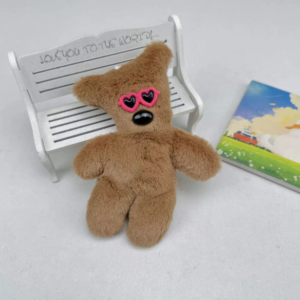 A collection of classic brown plush teddy bear keychains in various quirky styles attached to a bag.