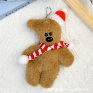 A collection of classic brown plush teddy bear keychains in various quirky styles attached to a bag.