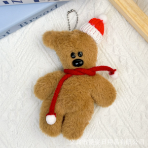A collection of classic brown plush teddy bear keychains in various quirky styles attached to a bag.